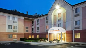 A hotel with a modern exterior, a prominent entrance, and a parking lot. - Sonesta Simply Suites Knoxville (Knoxville)