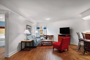 Premium Suite, 2 Bedrooms | Living room | 55-inch flat-screen TV with cable channels, TV, Netflix