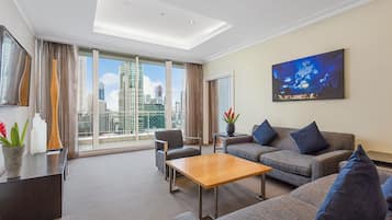 Penthouse Crown Suite | Living area | 48-inch LCD TV with cable channels, TV, iPod dock
