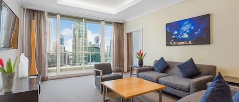 Penthouse Crown Suite | Living area | 48-inch LCD TV with cable channels, TV, iPod dock