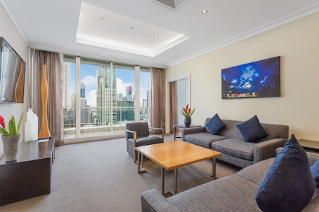 Penthouse Crown Suite | Living area | 48-inch LCD TV with cable channels, TV, iPod dock. Clarion Suites Gateway