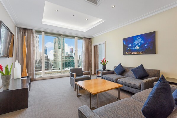 Penthouse Crown Suite | Living area | 48-inch LCD TV with cable channels, TV, iPod dock - Clarion Suites Gateway (Melbourne)