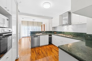 Penthouse Flinders Reach Suite | Private kitchen | Fridge, microwave, coffee/tea maker, freezer