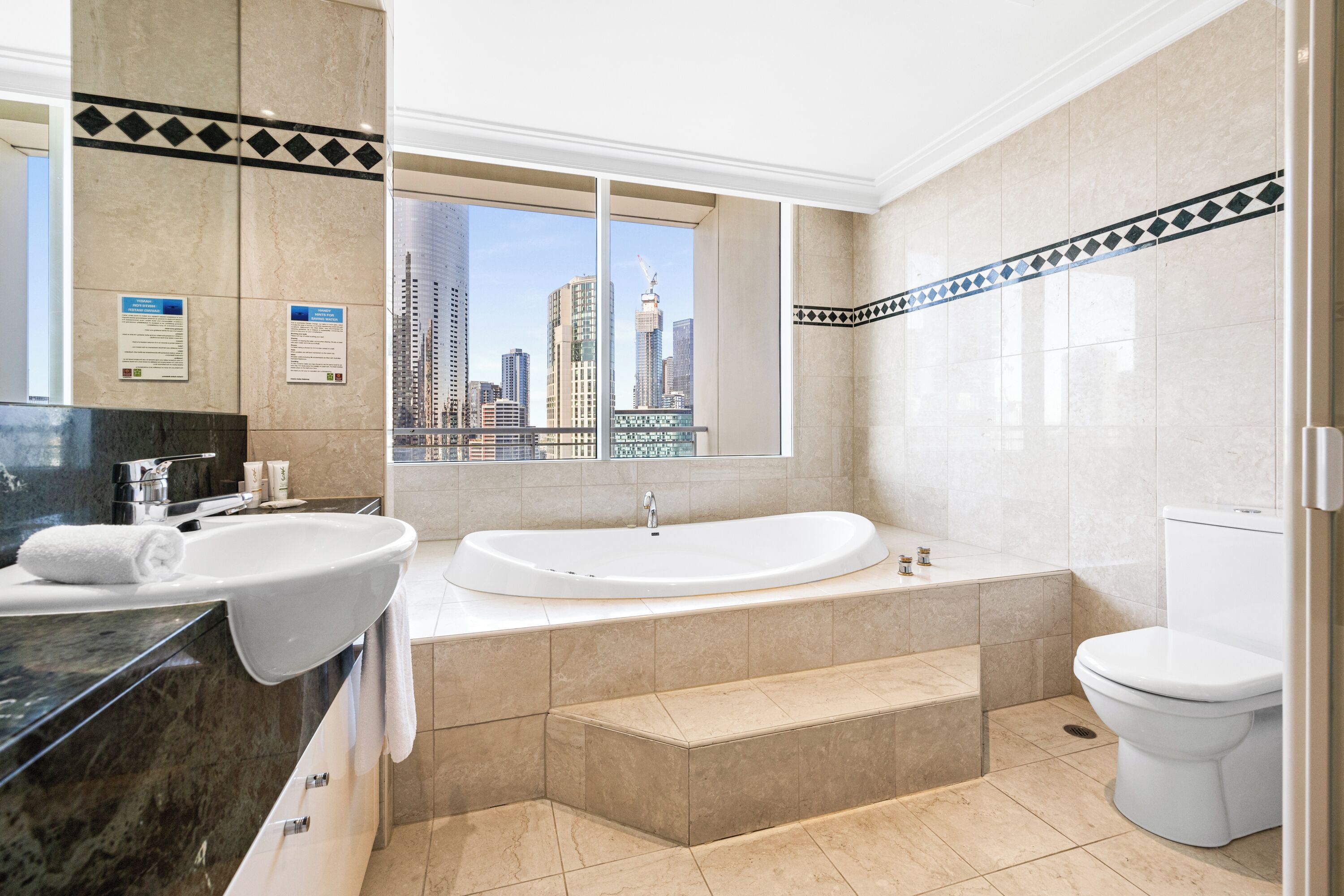 penthouse flinders reach suite | bathroom | shower, free toiletries, hair dryer, towels