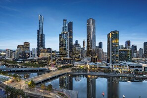 A city skyline with modern high-rise buildings, a waterfront, and a bridge. - Clarion Suites Gateway (Melbourne)