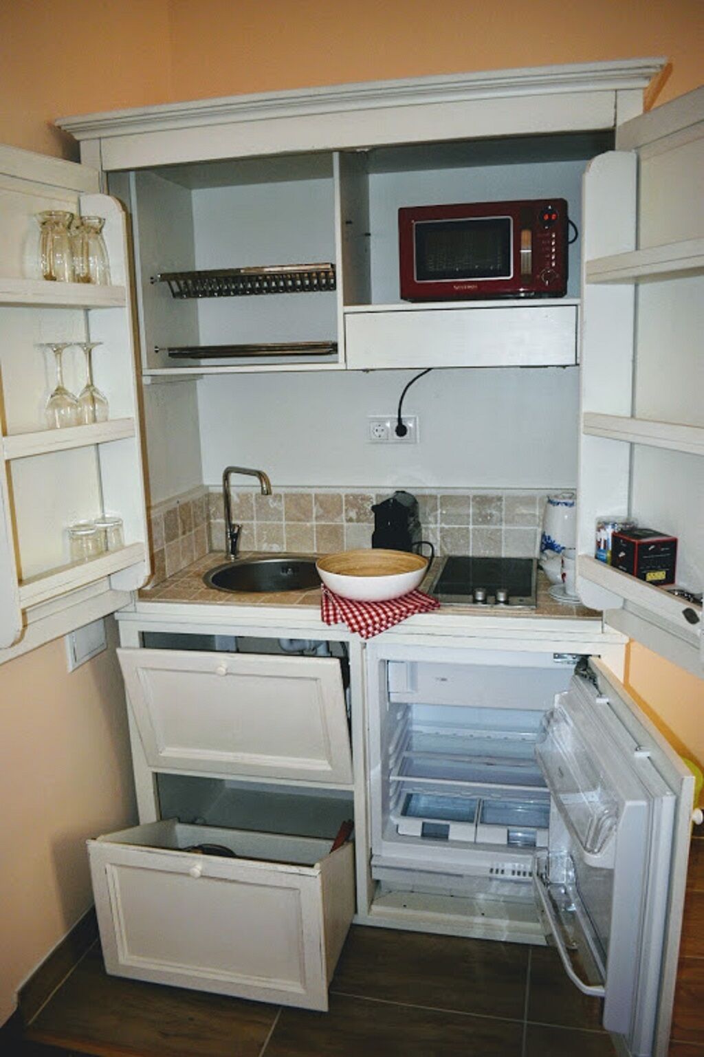 full-sized fridge, microwave, stovetop, espresso maker