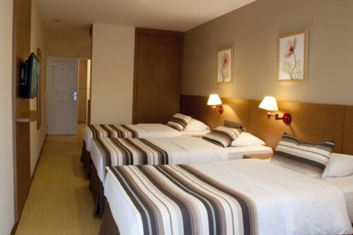 Suite, 3 Twin Beds | Minibar, in-room safe, laptop workspace, blackout drapes