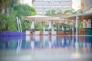 Outdoor pool, open 10:30 AM to 5:00 PM, pool umbrellas, pool loungers