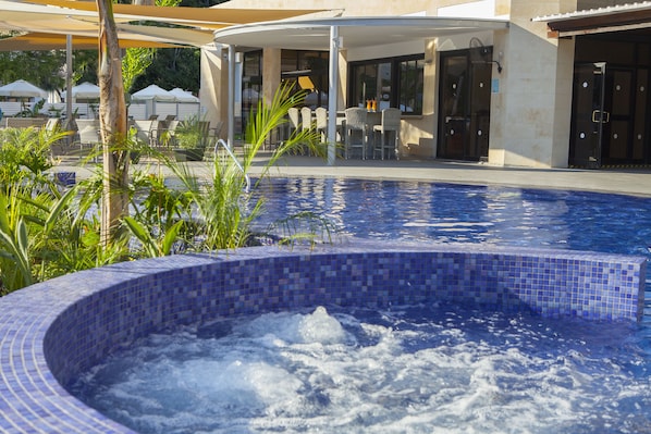Outdoor pool, open 10:30 AM to 5:00 PM, pool umbrellas, pool loungers