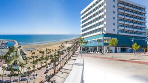 A hotel with a view of the beach and ocean, featuring a modern design with multiple floors and balconies. - Sun Hall Hotel (Larnaca)