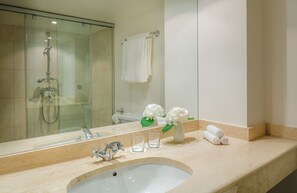 Designer toiletries, hair dryer, bathrobes, slippers