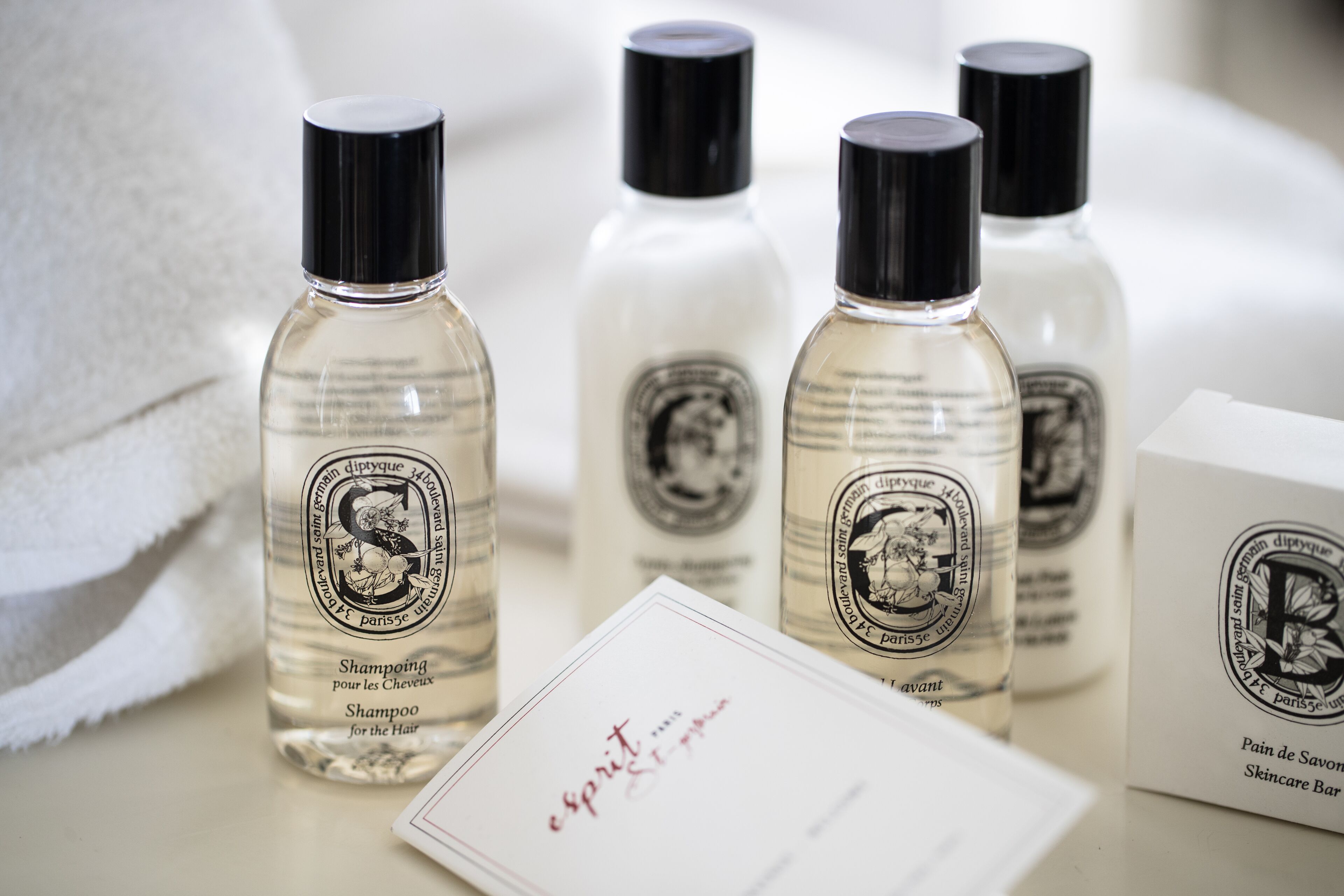 combined shower/bathtub, designer toiletries, hair dryer, bathrobes