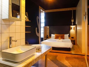 A modern hotel room with a large bed, a bedside table with a white sink, and a view of the outdoors. - Greet Hotel  Lyon Confluence (Lyon)