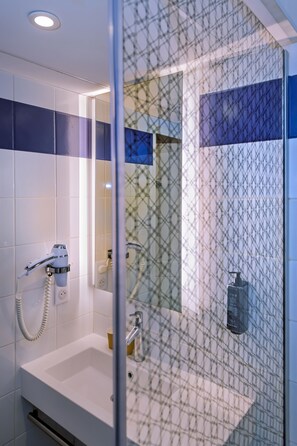Eco-friendly toiletries, hair dryer, towels