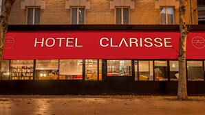 A hotel named HOTEL CLARISSE with a red awning and multiple windows. - Hôtel Clarisse (Paris)
