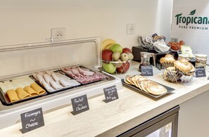 A breakfast buffet with labeled sections for various food items such as cheese, chicken, and pork. - Hotel Courseine (Courbevoie)