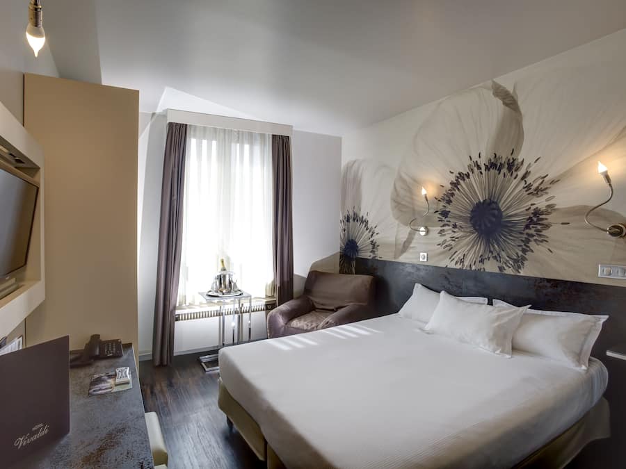 Standard Double Room | Minibar, in-room safe, desk, blackout curtains