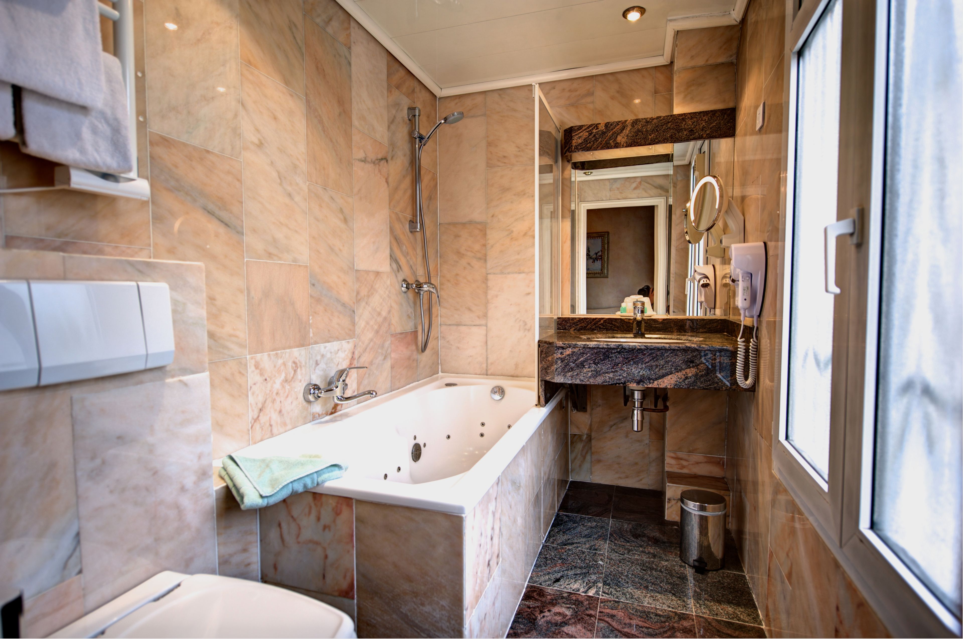 deluxe double room, 1 queen bed | bathroom | free toiletries, hair dryer, towels