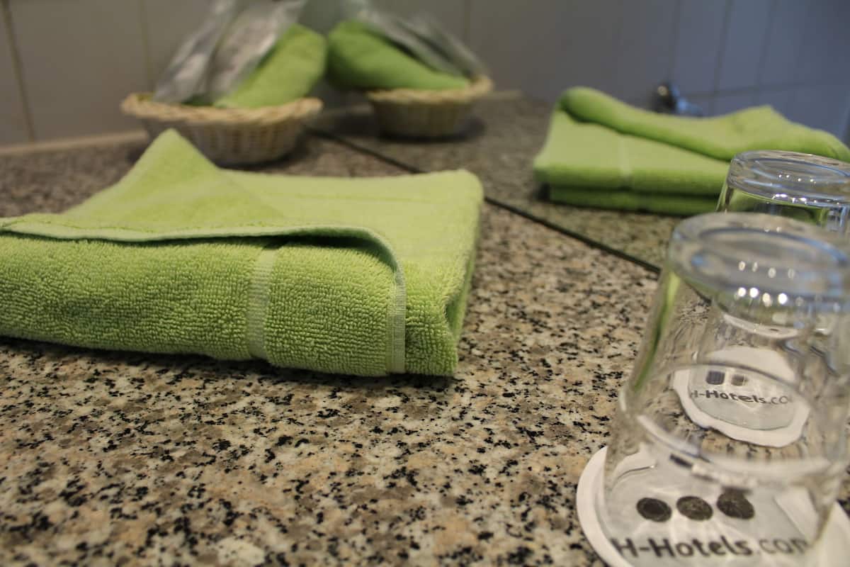 bathtub, free toiletries, hair dryer, towels