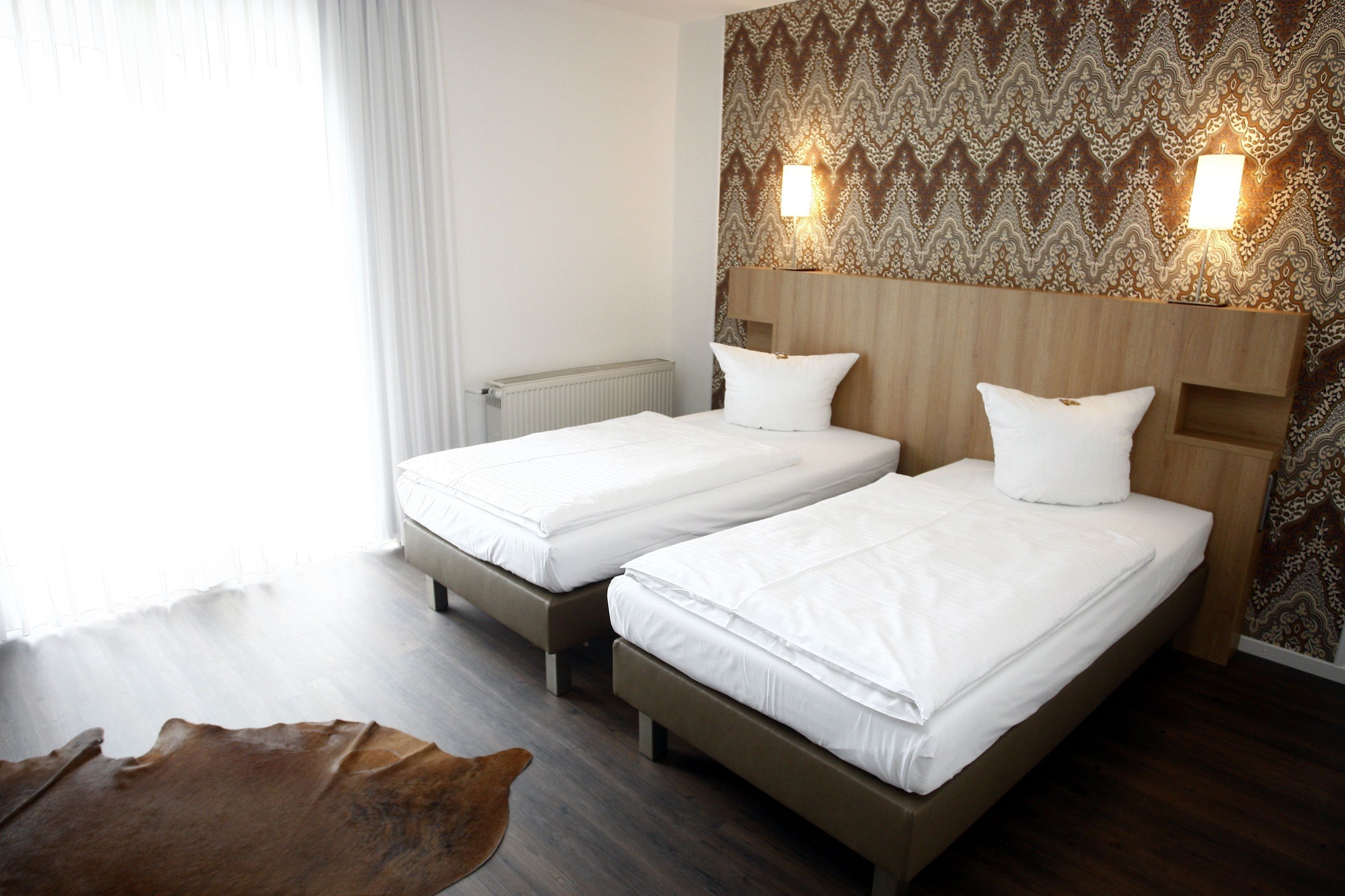 hypo-allergenic bedding, down duvets, minibar, in-room safe