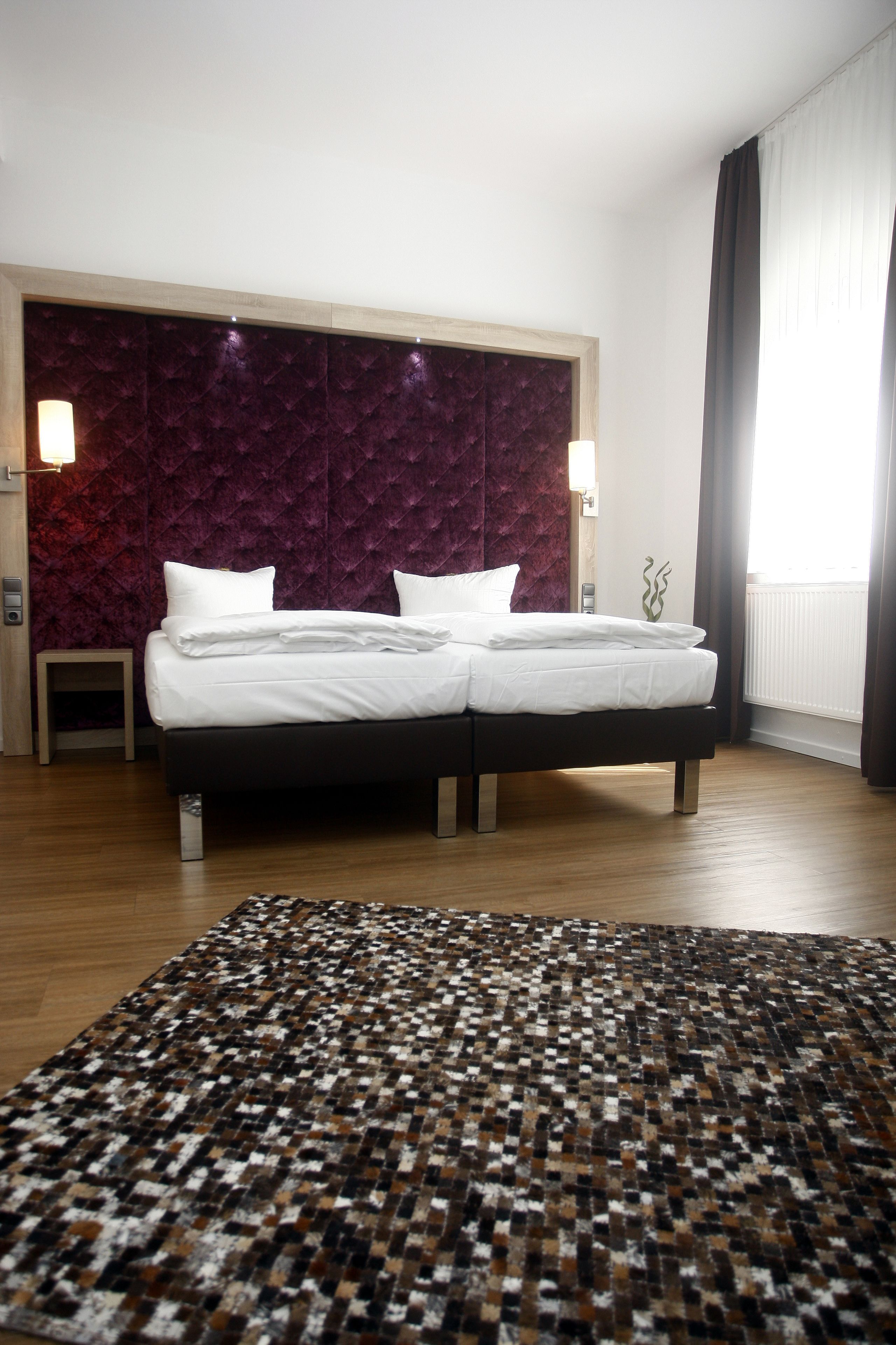 hypo-allergenic bedding, down duvets, minibar, in-room safe