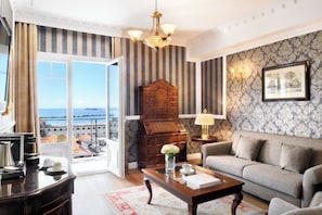 Sea View Executive Suite | Living area | 32-inch LCD TV with satellite channels