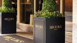 Two black planters with 'Brooks Hotel' branding and a doormat with the same name. - Brooks Hotel (Dublin)