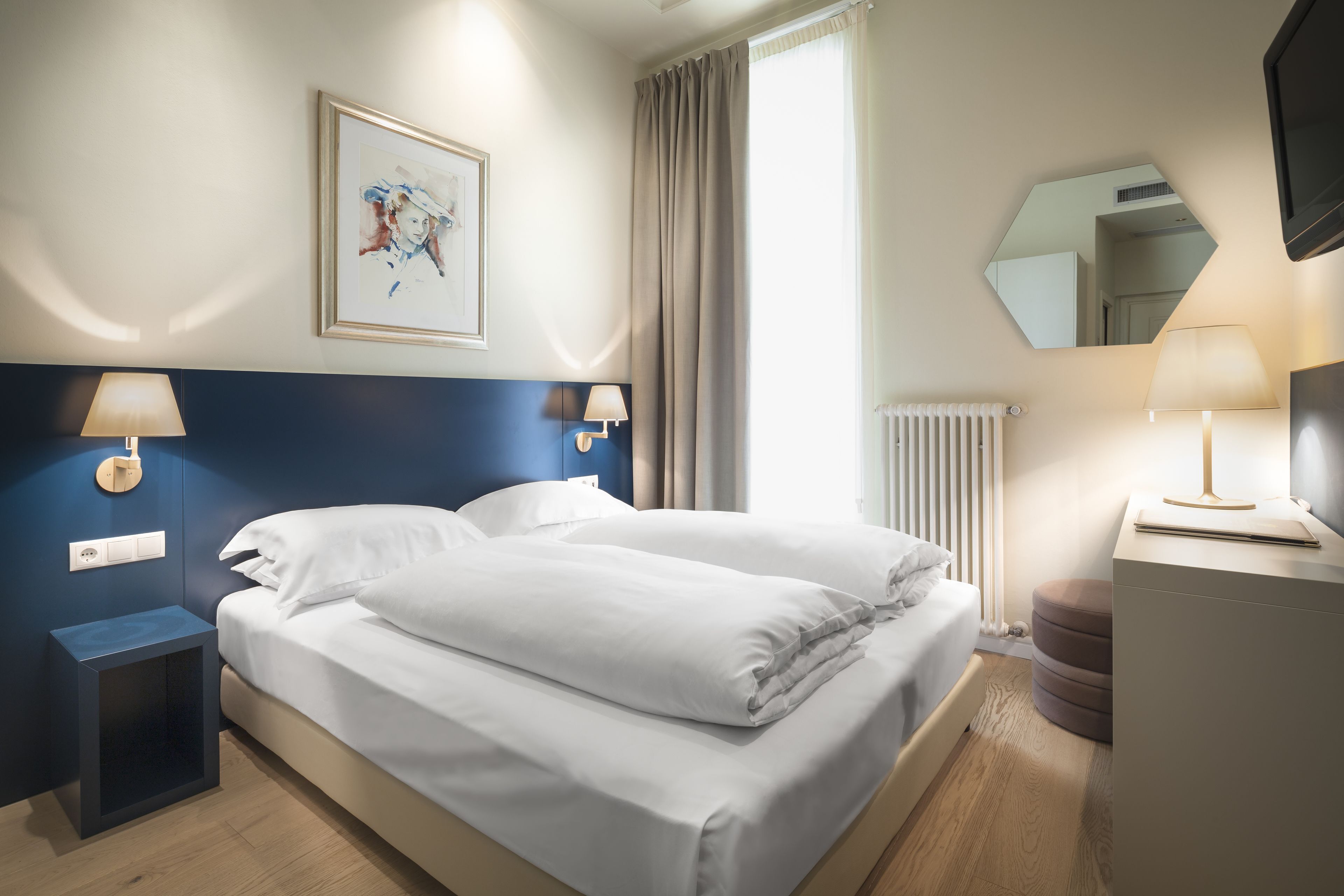 Hypo-allergenic bedding, down comforters, minibar, in-room safe