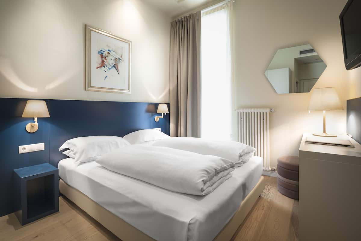 Hypo-allergenic bedding, down duvets, minibar, in-room safe