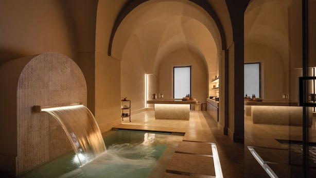 A spa area with a water feature, arched ceilings, and a reception desk. - Patria Palace Hotel Lecce - Leading Hotels of the World (Lecce)
