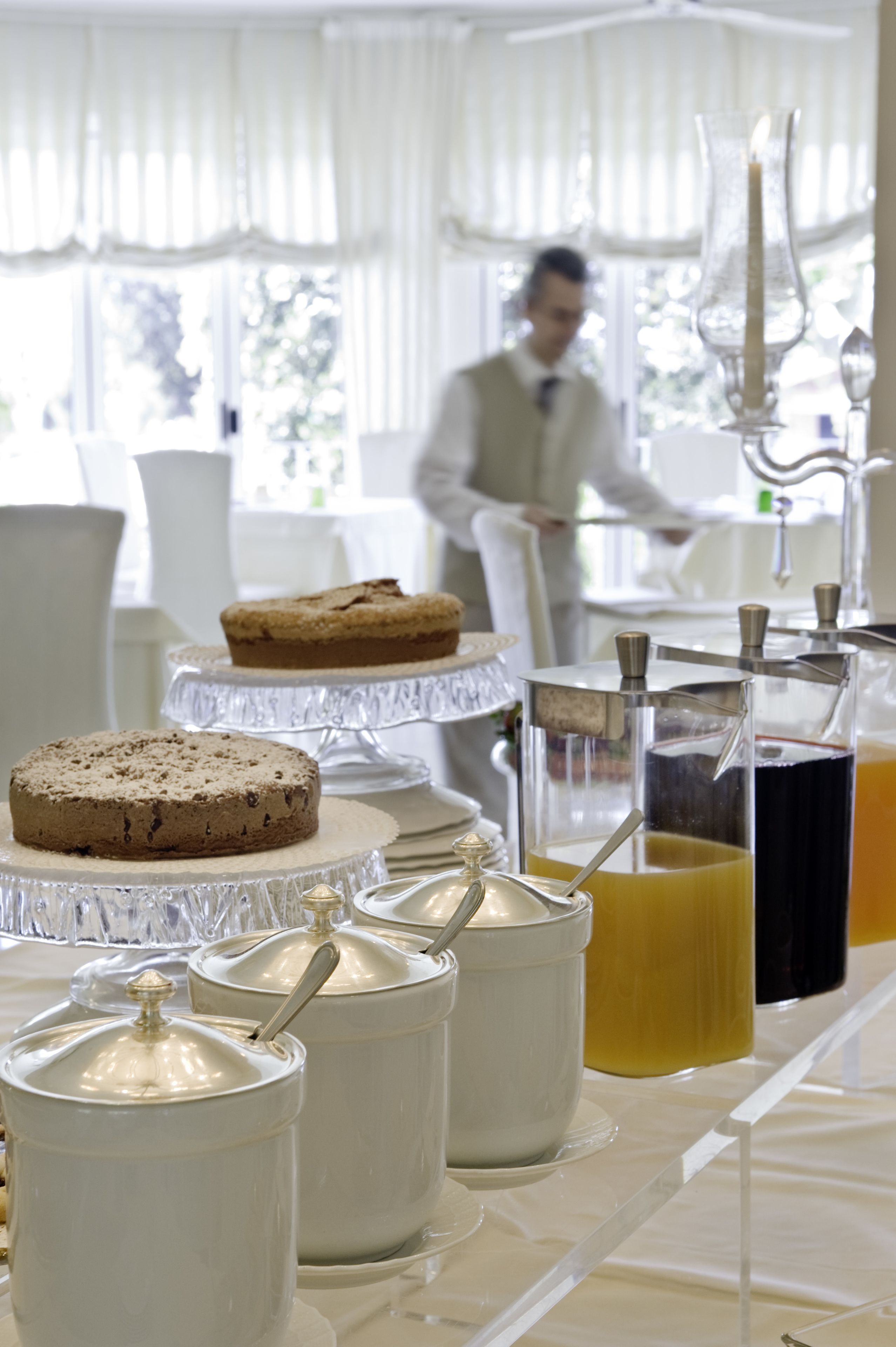 A buffet setup with various food items and beverages.