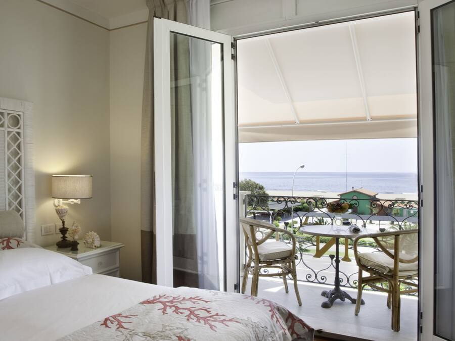Classic Double Room, Balcony, Sea View | Minibar, in-room safe, desk, blackout drapes