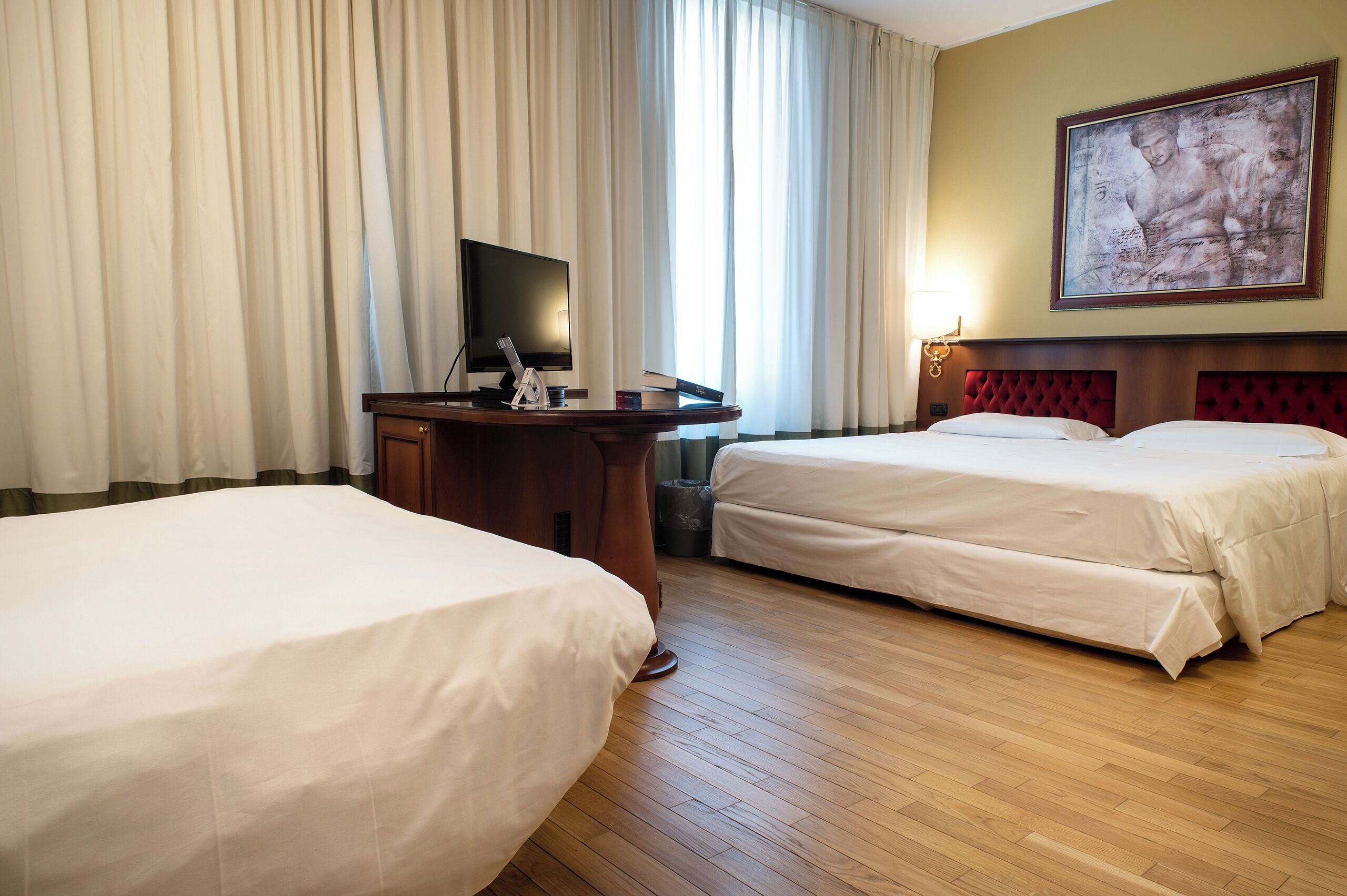 comfort quadruple room | premium bedding, down duvets, in-room safe, desk