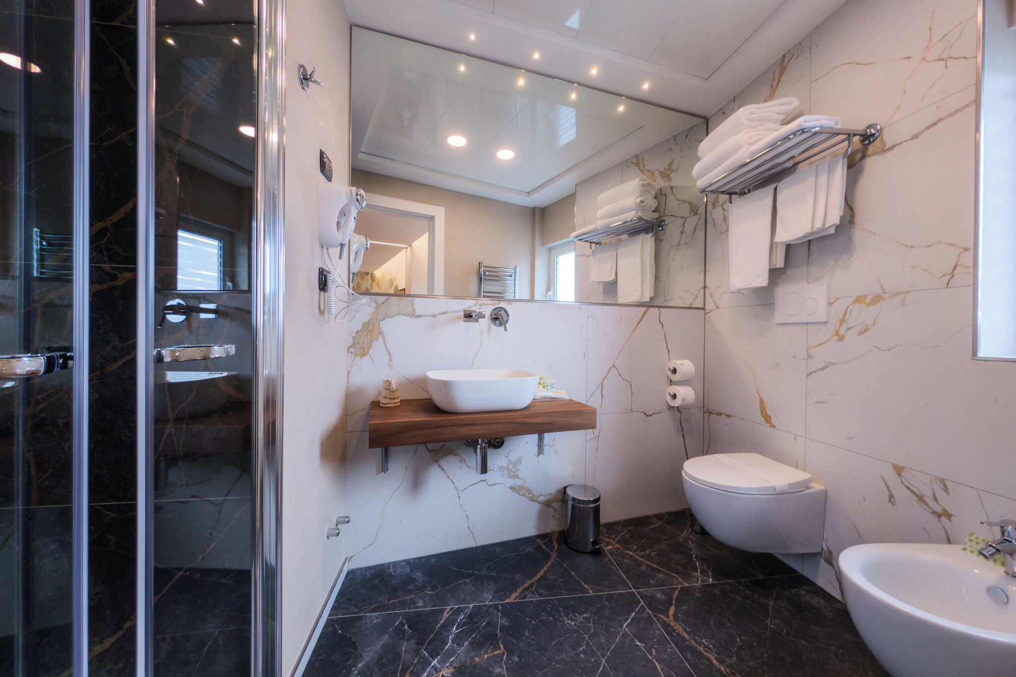 quadruple room | bathroom | free toiletries, hair dryer, bidet, towels