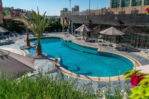 Seasonal outdoor pool, open 9:00 AM to 6:00 PM, pool umbrellas