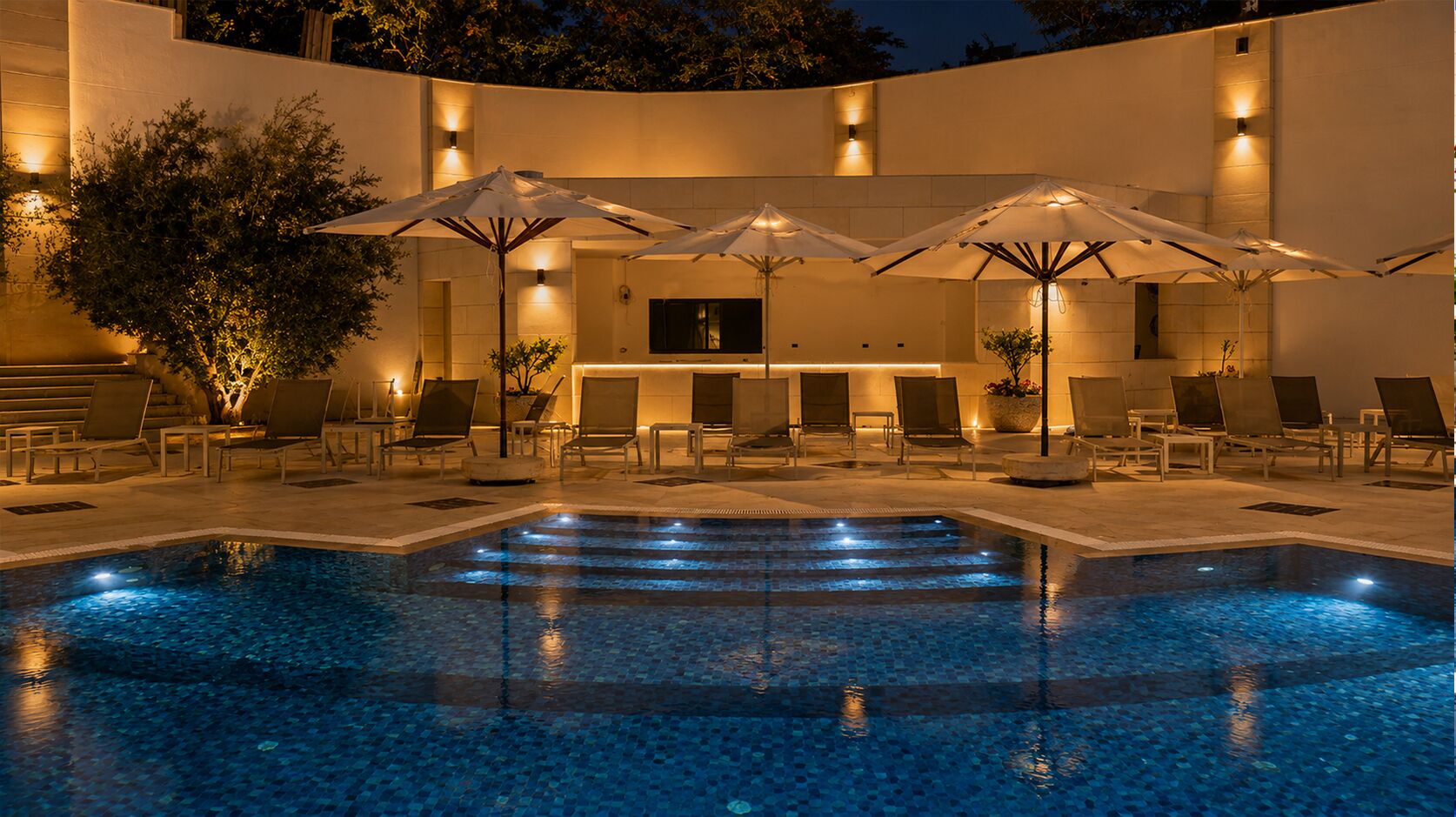 Seasonal outdoor pool, open 9:00 AM to 6:00 PM, pool umbrellas
