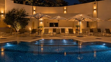 Seasonal outdoor pool, open 9:00 AM to 6:00 PM, pool umbrellas
