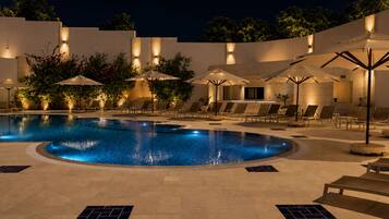 Seasonal outdoor pool, open 9:00 AM to 6:00 PM, pool umbrellas