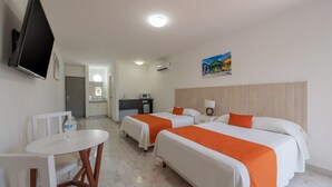 A hotel room with two beds, a desk, a chair, a television, and a painting on the wall. - Hotel Imperial Laguna Faranda (Cancun)