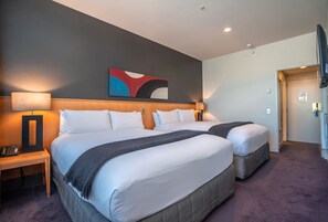 Suite, 2 Queen Beds, Tower | Premium bedding, desk, iron/ironing board, free cribs/infant beds