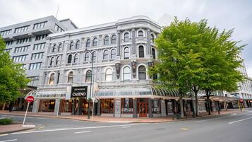 Experience the grandeur of the Dunedin Casino, a historic building with a classic architectural style, featuring a prominent marquee and ornate detailing.