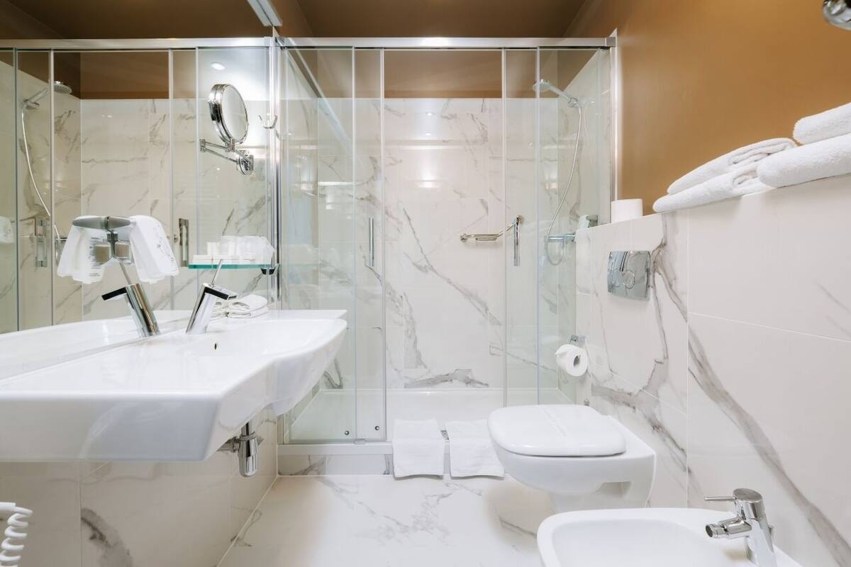 family room | bathroom | shower, free toiletries, hair dryer, dressing gowns