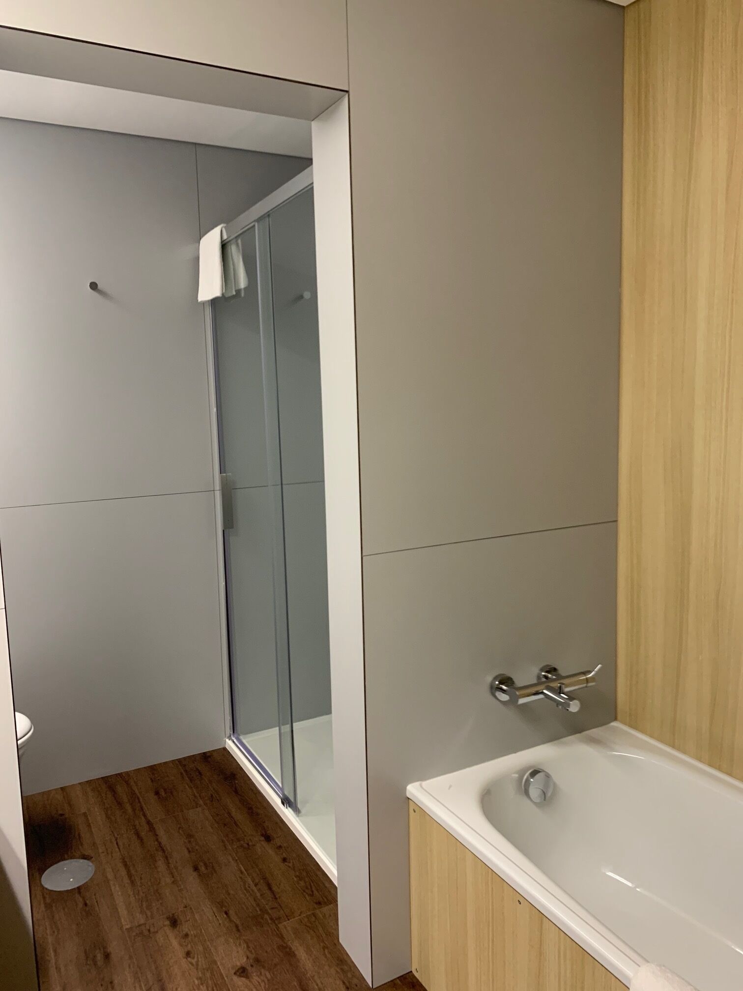 deluxe room, 1 queen bed | bathroom | deep-soaking bathtub, hair dryer, bidet, towels