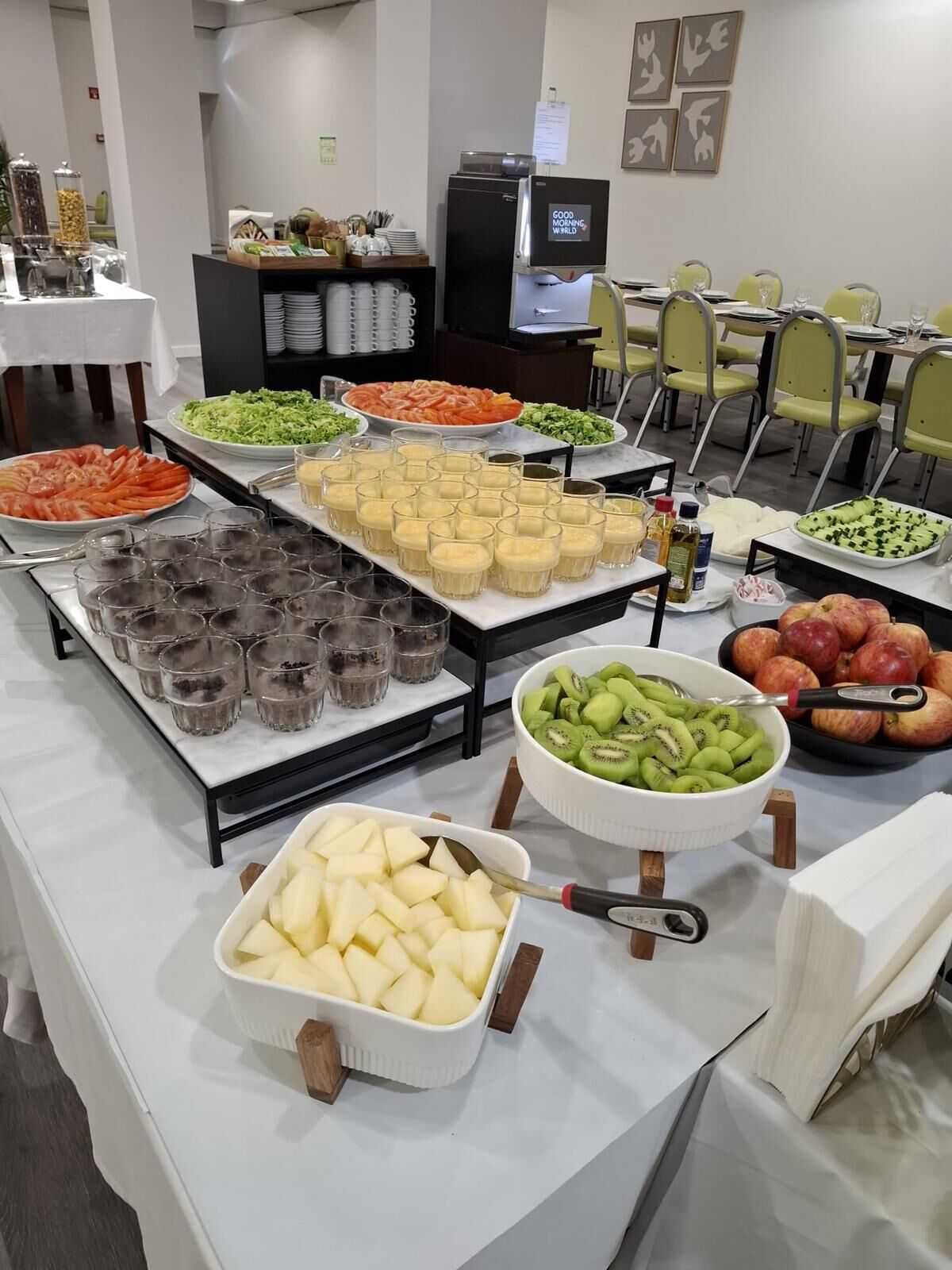 A buffet setup with various food items and beverages.