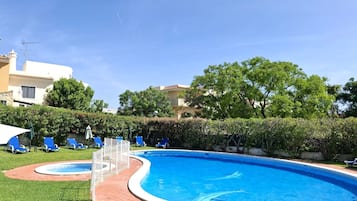 Seasonal outdoor pool, pool loungers