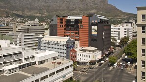 A modern building with multiple floors, large windows, and a prominent entrance. - Cape Town Lodge Hotel (Cape Town)