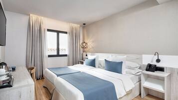 Luxe beddengoed, een minibar, een kluis op de kamer, een bureau