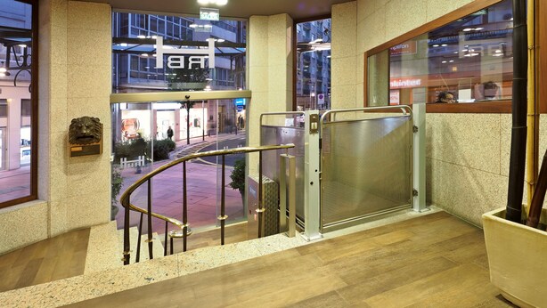 A modern hotel lobby with a staircase leading to an upper floor. - Rias Bajas (Pontevedra)