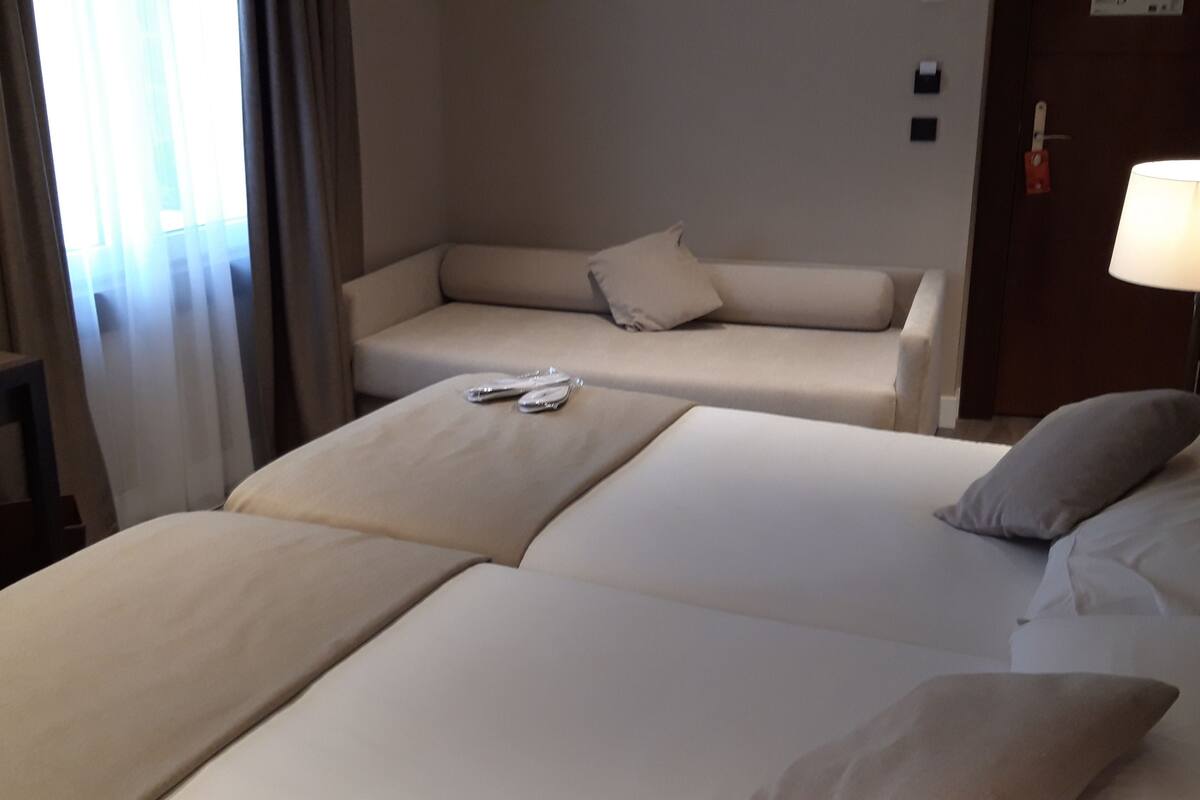 superior triple room | down duvets, minibar, in-room safe, desk