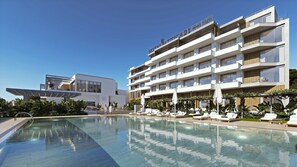 Outdoor pool, pool umbrellas, sun loungers